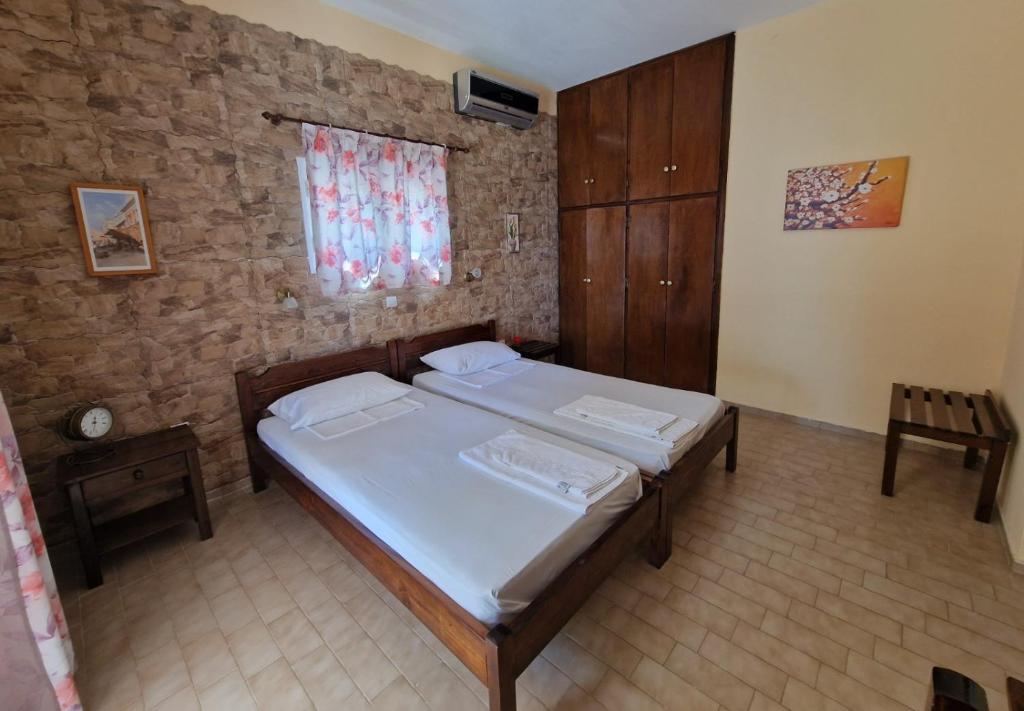 Postel nebo postele na pokoji v ubytování Atisis Apartments