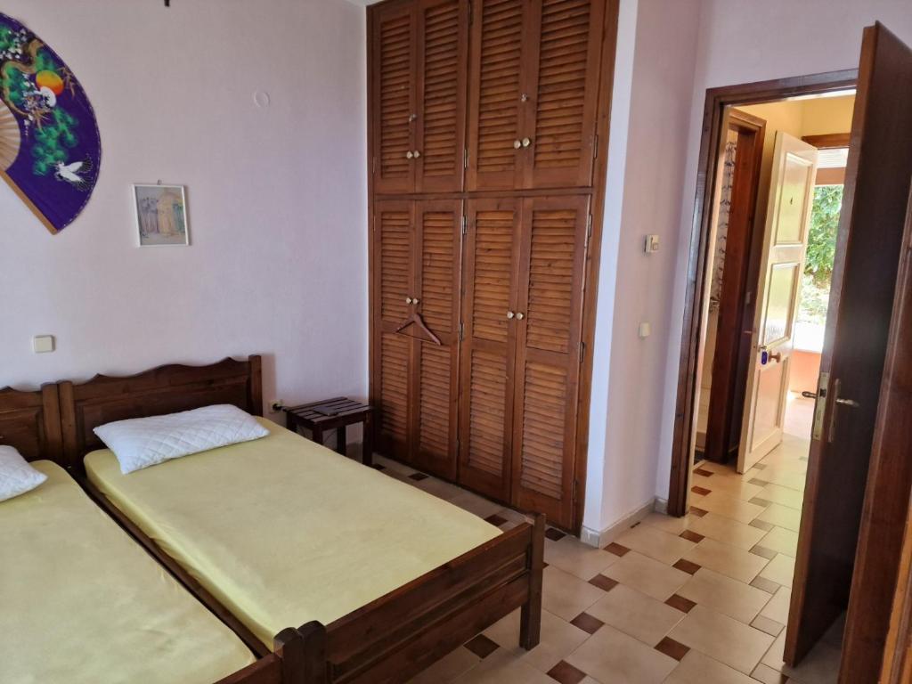Postel nebo postele na pokoji v ubytování Atisis Apartments
