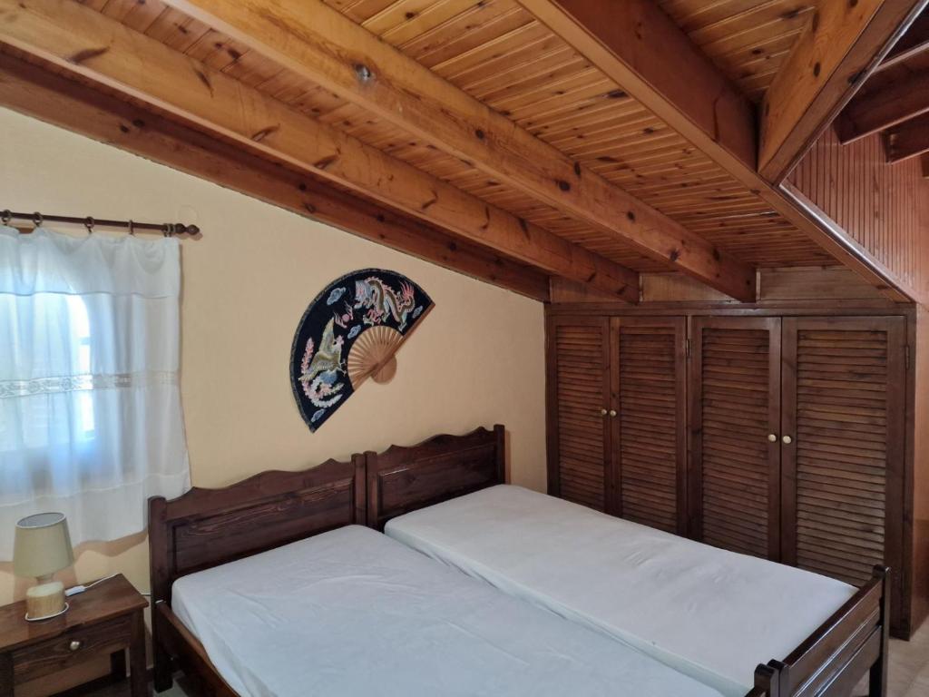 Postel nebo postele na pokoji v ubytování Atisis Apartments