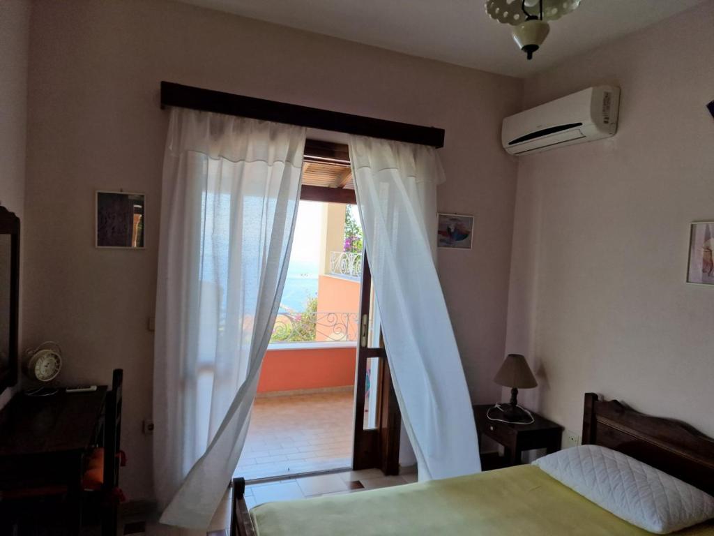 Postel nebo postele na pokoji v ubytování Atisis Apartments