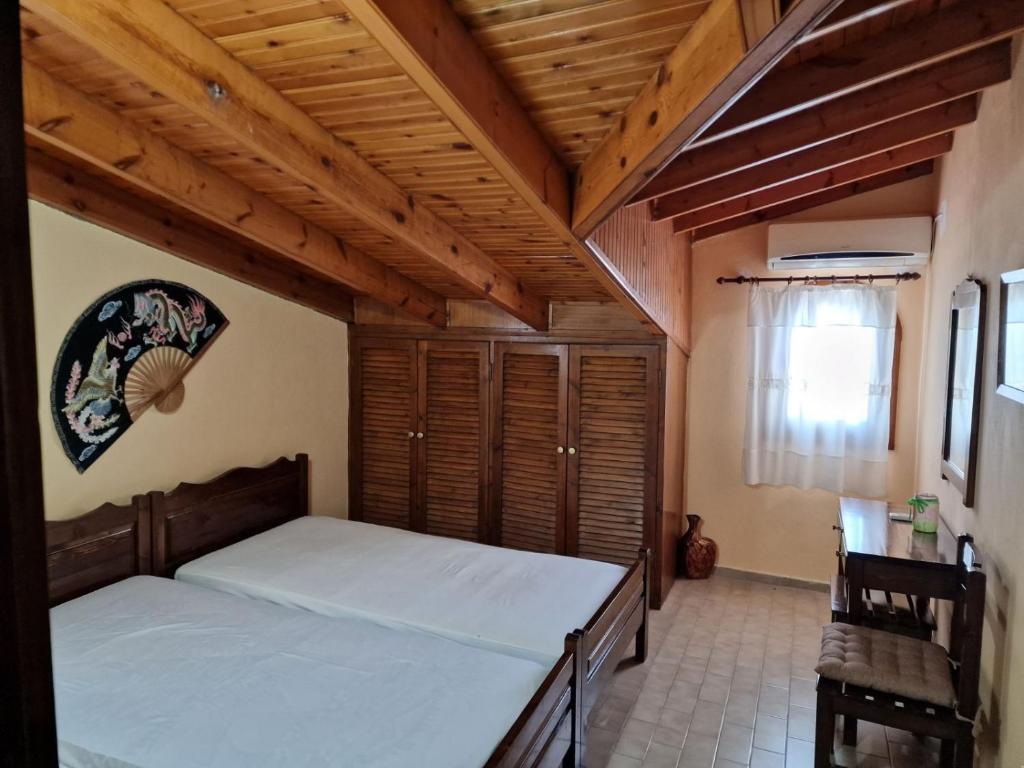 Postel nebo postele na pokoji v ubytování Atisis Apartments