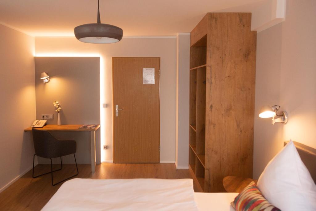 Postel nebo postele na pokoji v ubytování Hotel Herrnbrod & Ständecke