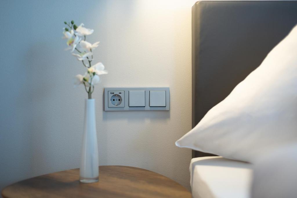 Postel nebo postele na pokoji v ubytování Hotel Herrnbrod & Ständecke