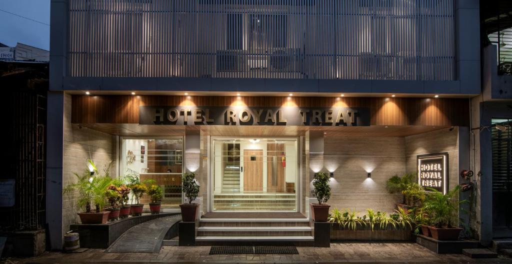 a building with a sign that reads hope revival heal at Hotel Royal Treat Surat in Surat