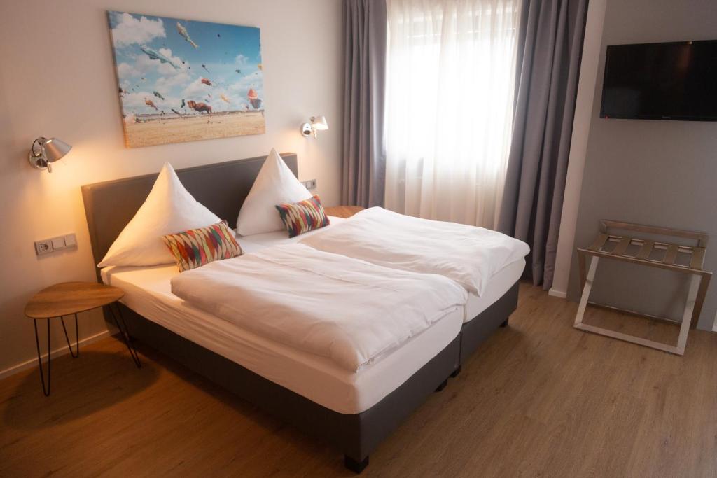 Postel nebo postele na pokoji v ubytování Hotel Herrnbrod & Ständecke