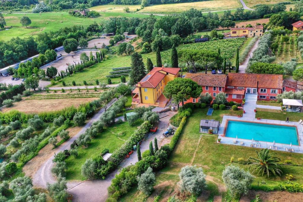 an aerial view of a house with a swimming pool at Agriturismo Corte Benedetto in Montecarlo