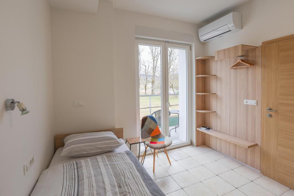Postel nebo postele na pokoji v ubytování Jazz Bled B&B