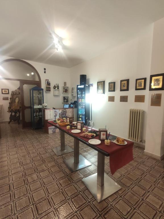 a room with a table with food on it at Nicolai63 in Bari