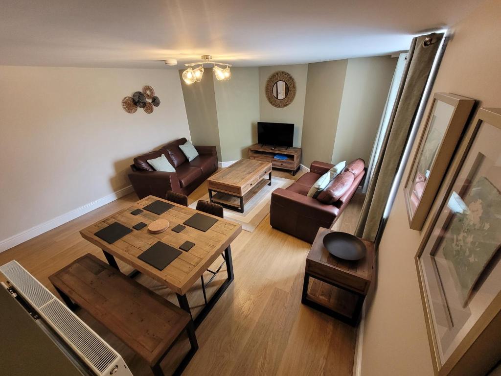 an overhead view of a living room with a table and chairs at Llys Bach Apartment at Llys Aeron in Aberaeron