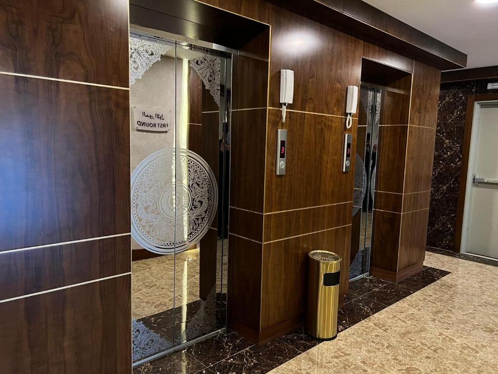 a bathroom with a shower with a glass door at Sweet Home For Serviced Accommodation in Jeddah