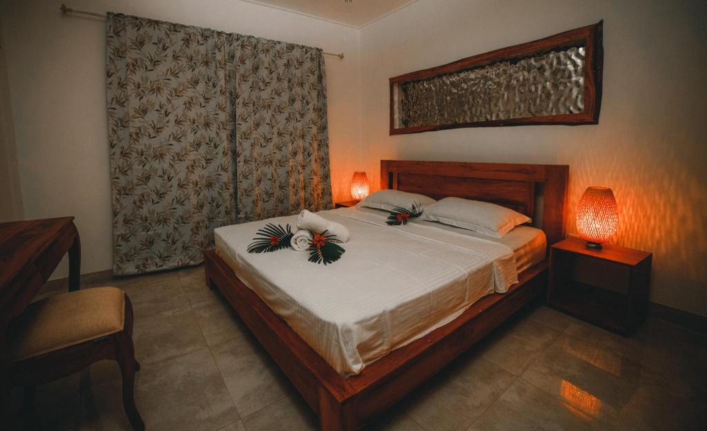 Postel nebo postele na pokoji v ubytování kannel Apartments