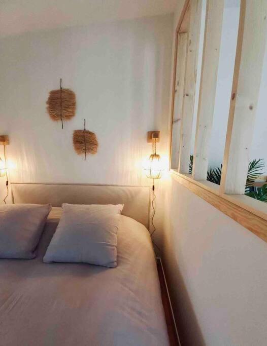 Posteľ alebo postele v izbe v ubytovaní Studio «  La Mouette Rieuse »