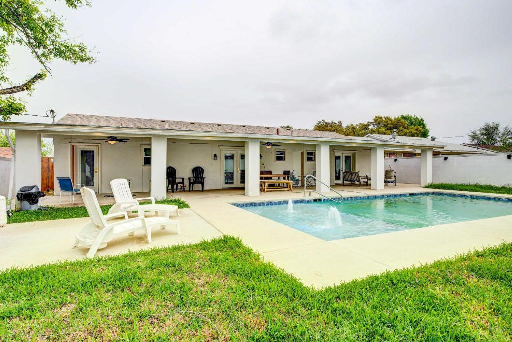 a house with a swimming pool and a patio at Centrally Located Eagle Pass Home with Pool! in Eagle Pass