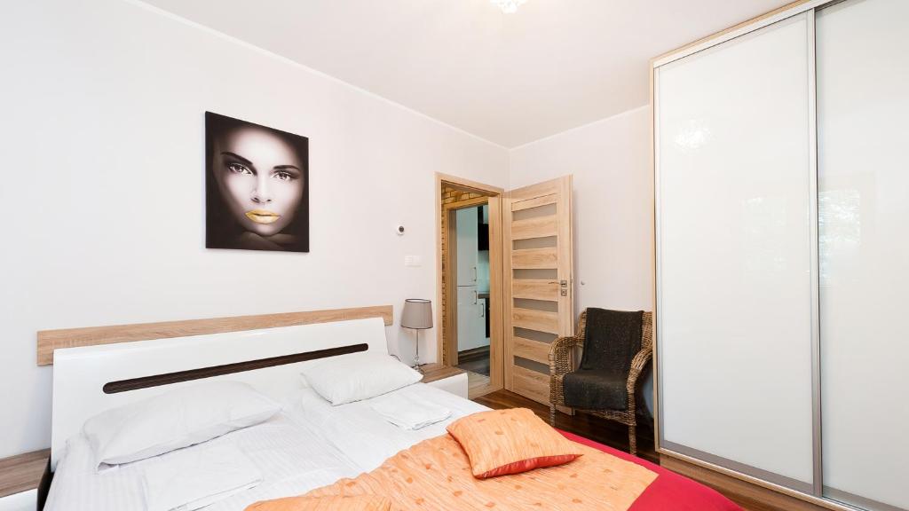 Posteľ alebo postele v izbe v ubytovaní Apartamenty Sun & Snow Poronin