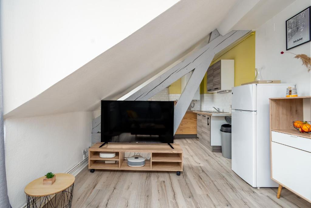 Kuchyňa alebo kuchynka v ubytovaní Le 38-GregIMMO-Appart'Hôtel