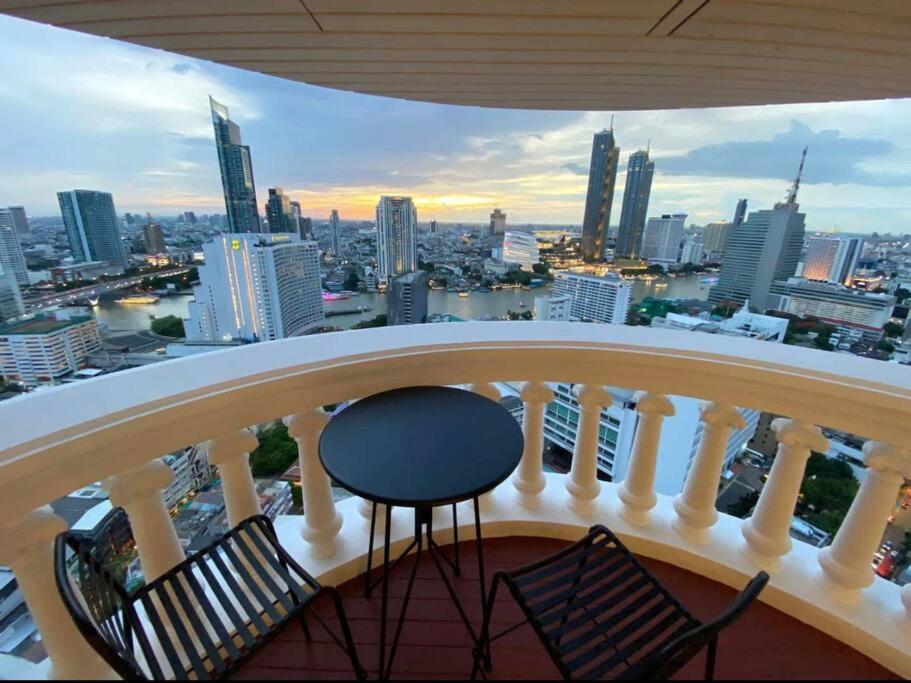 a balcony with a view of a city at Central Bangkok, 5 stars river view & characteristic decor in Bangkok