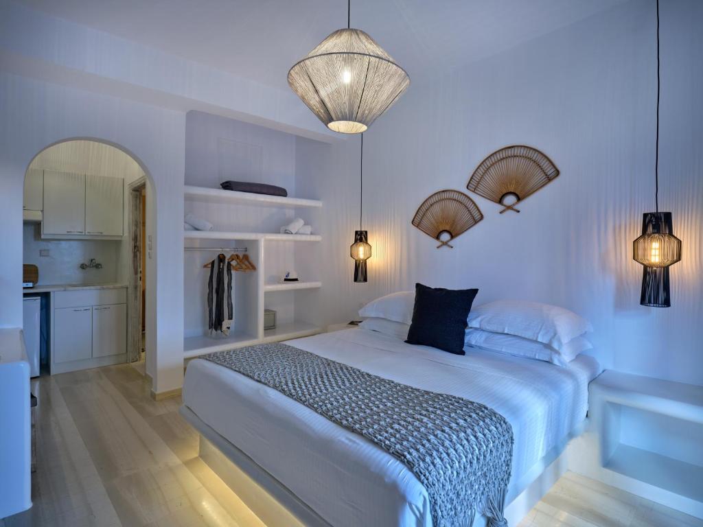 Postel nebo postele na pokoji v ubytování Ariti Seaside Residence