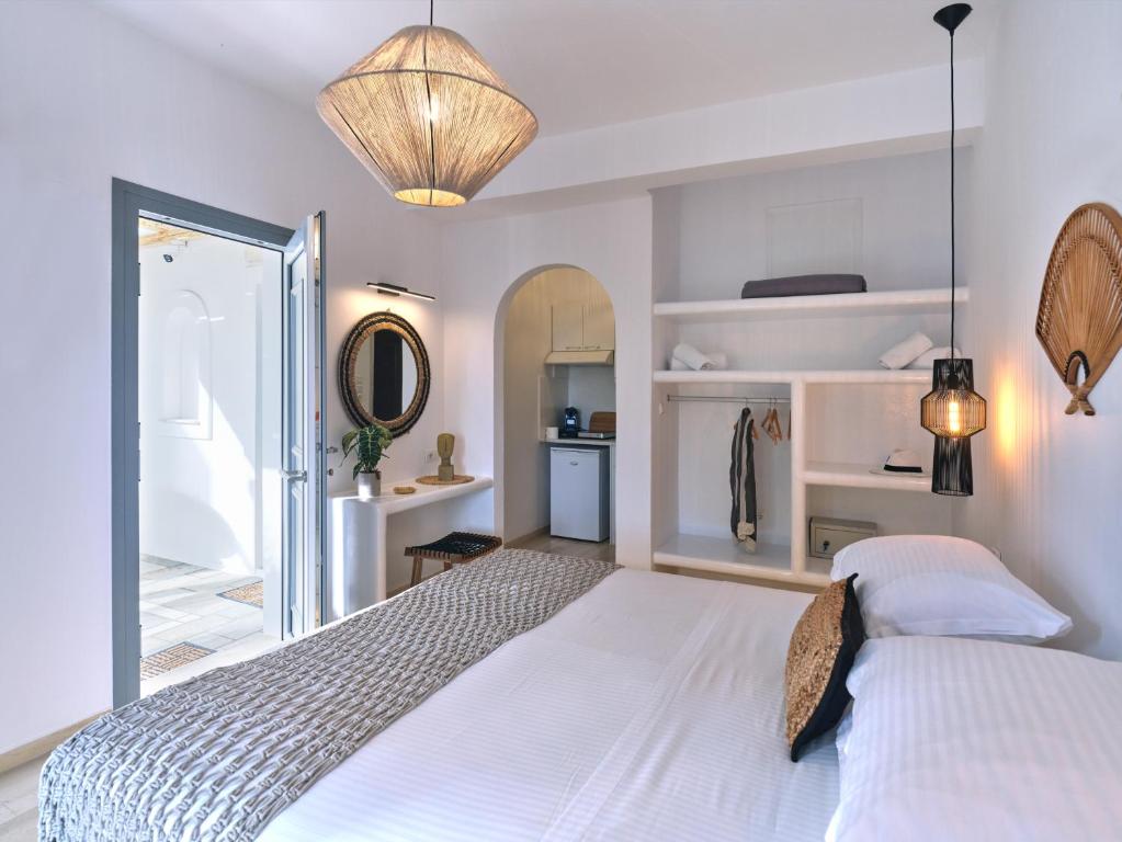 Postel nebo postele na pokoji v ubytování Ariti Seaside Residence