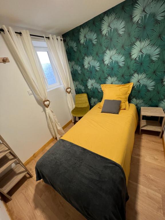 En eller flere senge i et værelse på Les Gîtes de la Bergerie - Boule de Neige