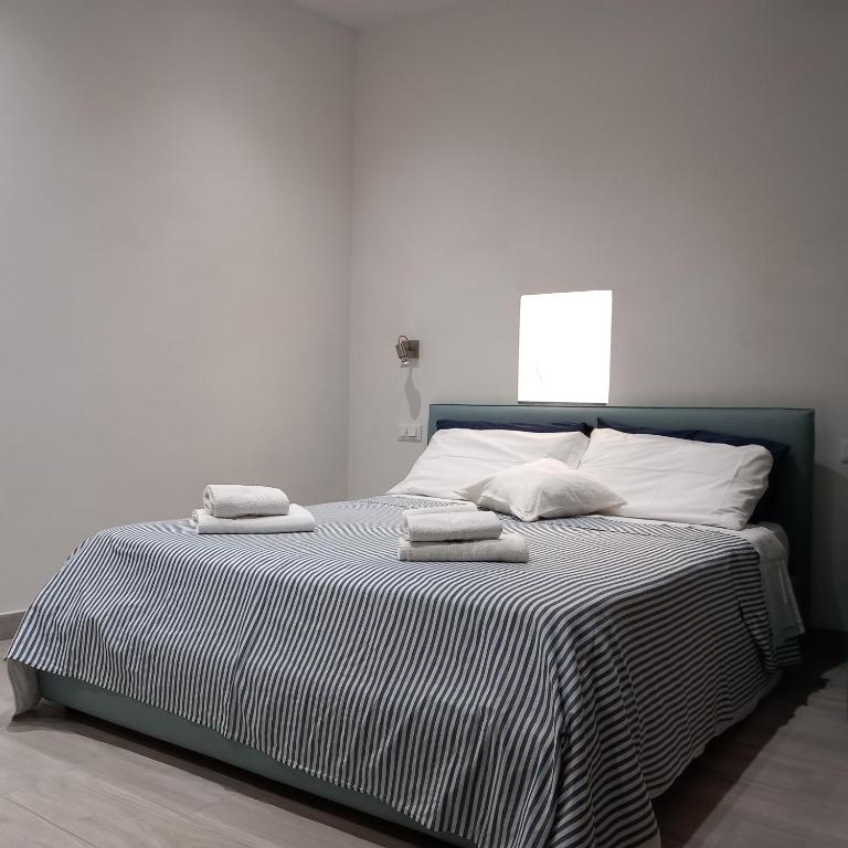 Łóżko lub łóżka w pokoju w obiekcie Casa Isabella De Luxe Studio