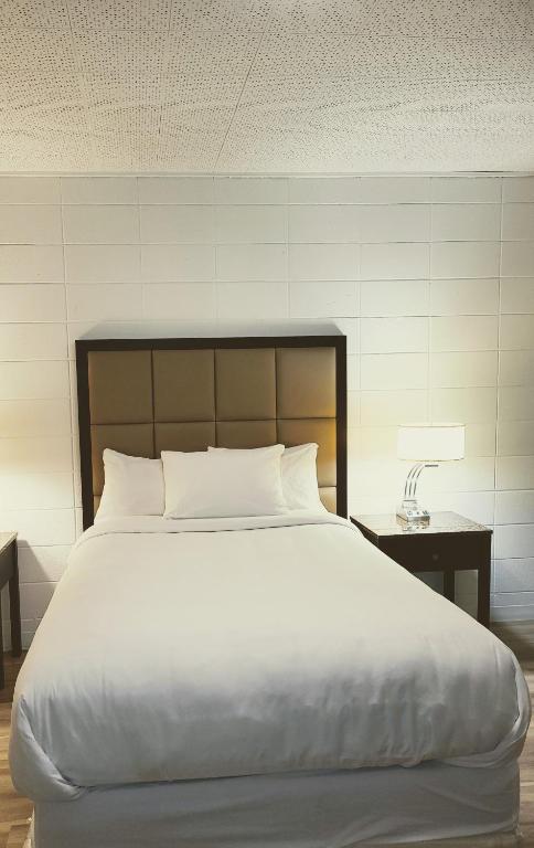 Postel nebo postele na pokoji v ubytování Hotel Sigma