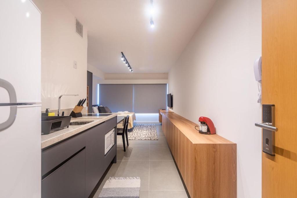 an office room with a kitchen and a classroom at LIV - Apartamento 904 in Porto Alegre