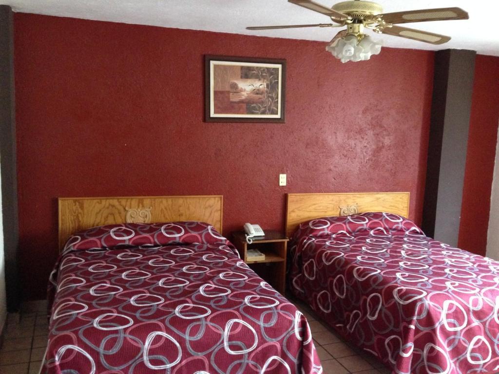 Postel nebo postele na pokoji v ubytování Hotel Primavera