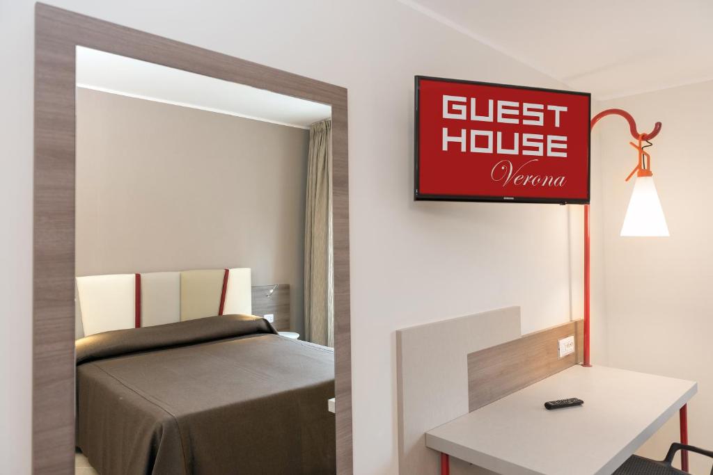 Postel nebo postele na pokoji v ubytování Guesthouse Verona