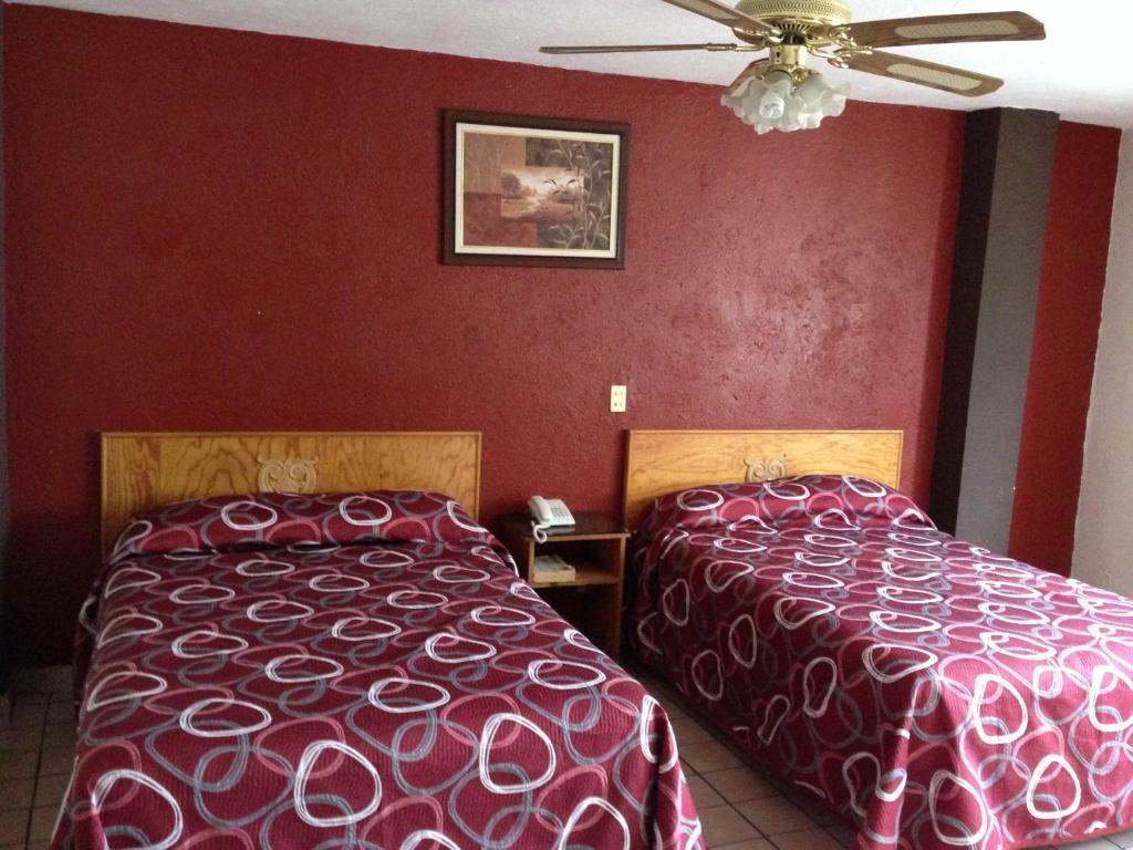 Postel nebo postele na pokoji v ubytování Hotel Primavera