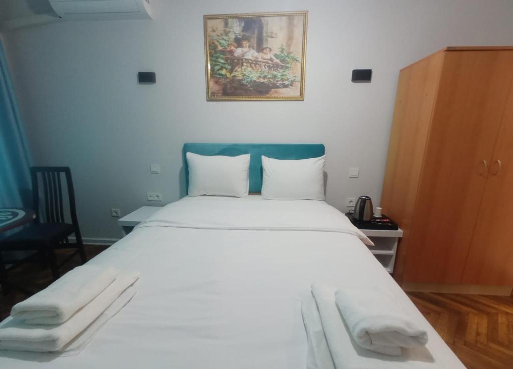Postel nebo postele na pokoji v ubytování Buyukada Cinar Hotel