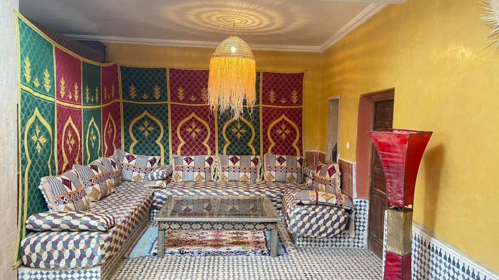 a living room with a couch and a table at Dar saafia in Marrakech