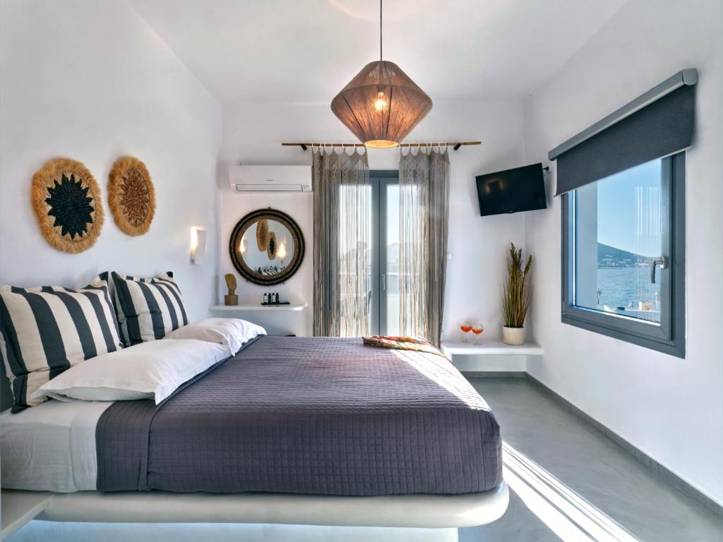 Postel nebo postele na pokoji v ubytování Ariti Seaside Residence