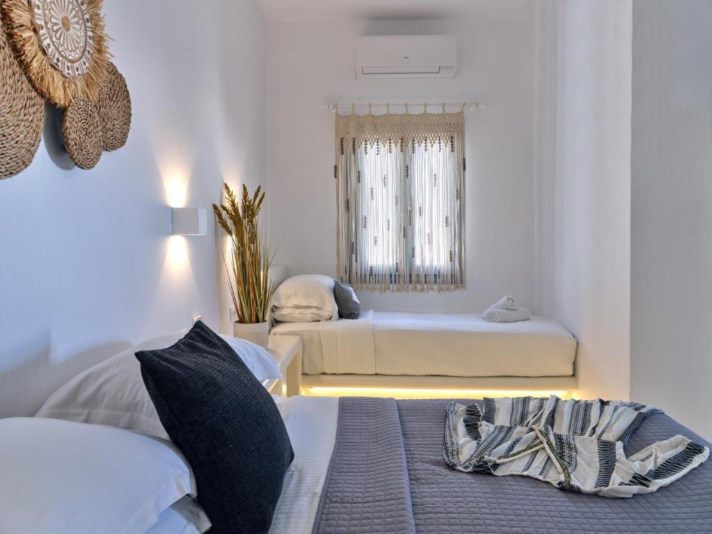 Postel nebo postele na pokoji v ubytování Ariti Seaside Residence