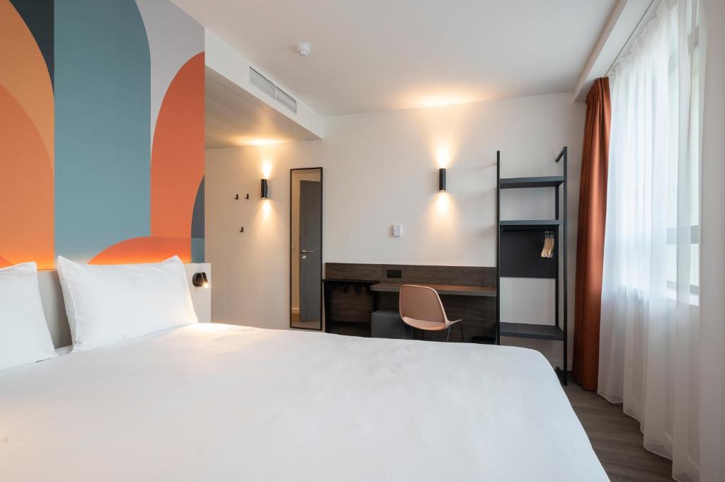 Postel nebo postele na pokoji v ubytování B&B HOTEL Mechelen