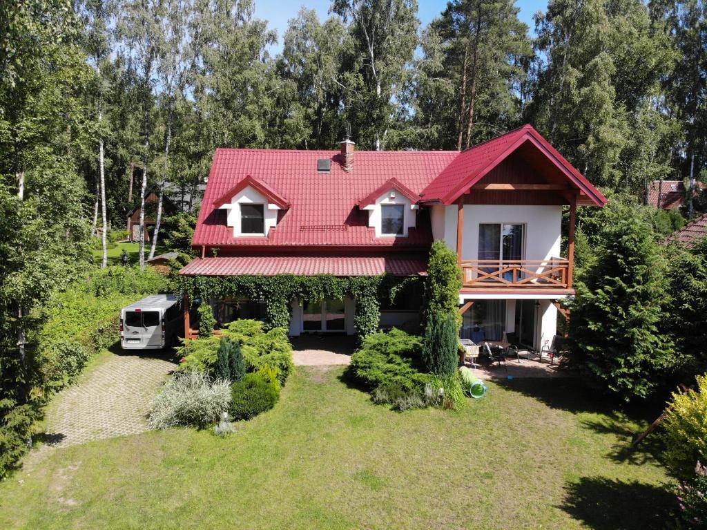 an aerial view of a house with a red roof at Mikolajek Nadmorski in Dębki