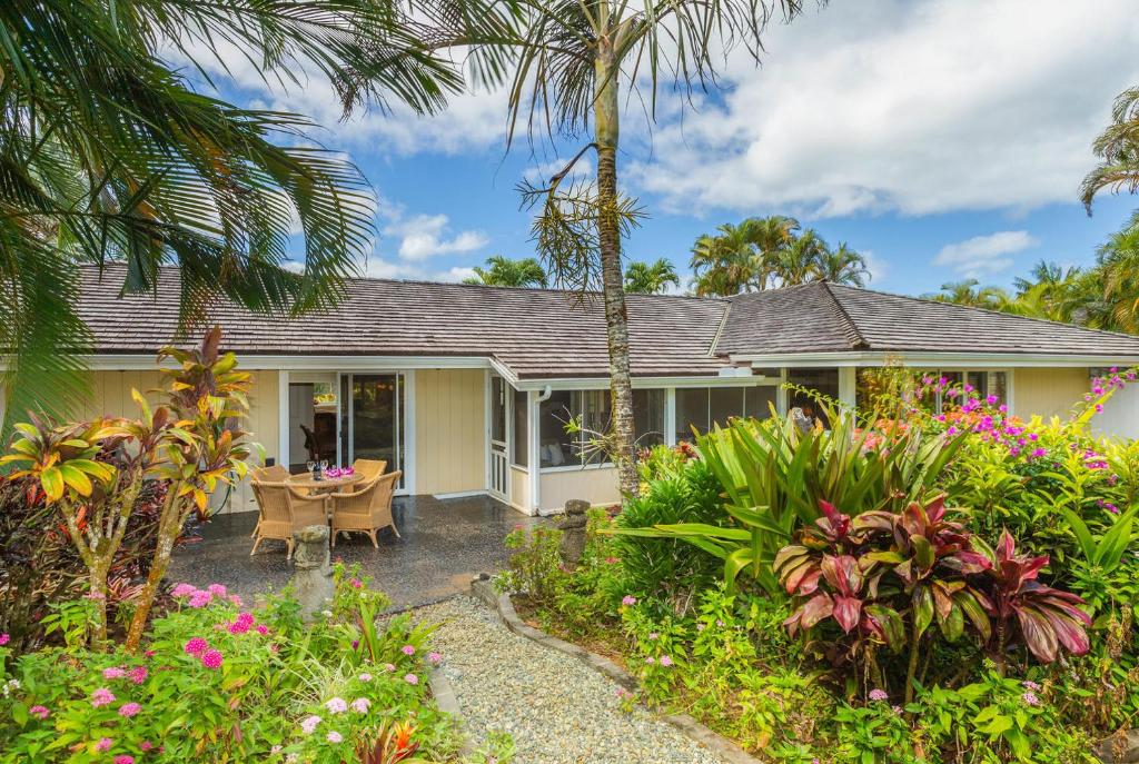 a house with a garden in front of it at Mala Hale in Princeville