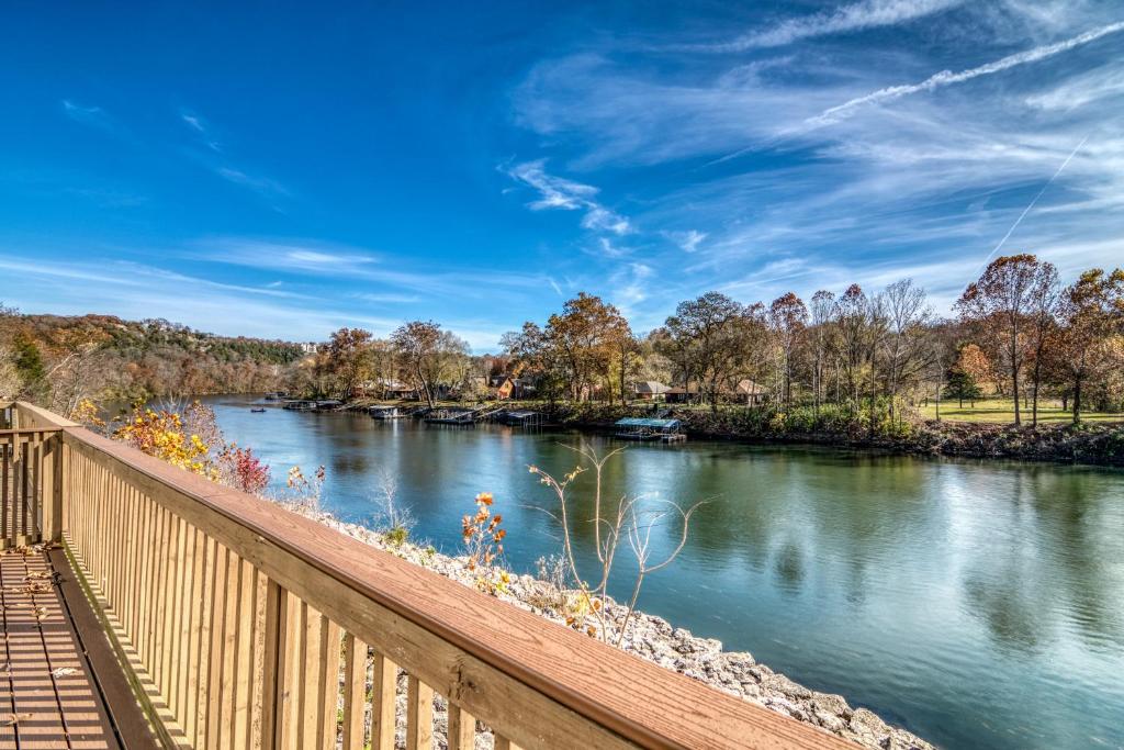 a view of a river with a wooden bridge at Family Friendly condo at Diamond Resorts! in Branson