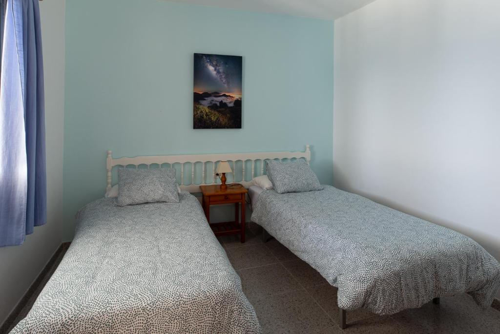 Posteľ alebo postele v izbe v ubytovaní Apartamentos con vistas al mar en El Remo