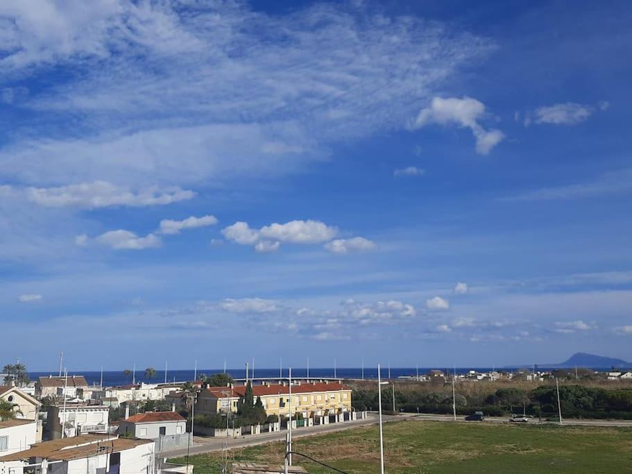 a view of a city with a blue sky at Apartamento en el Grao de Gandía in Gandía
