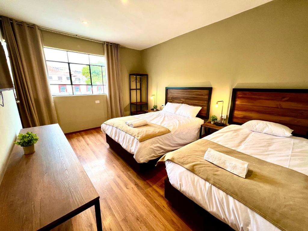 Postel nebo postele na pokoji v ubytování Hostal María Angola