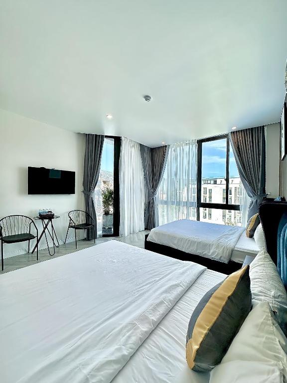 Postel nebo postele na pokoji v ubytování Tuấn Ninh Hotel II