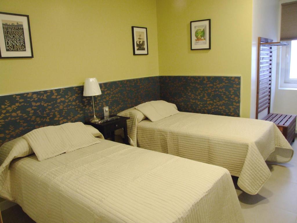 Posteľ alebo postele v izbe v ubytovaní Hostal Vintage Santander