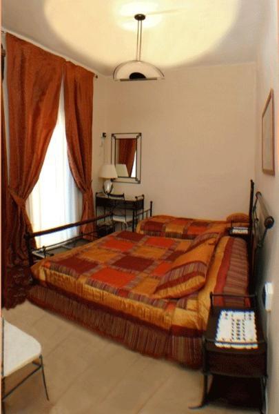 Łóżko lub łóżka w pokoju w obiekcie B&B Le Campane