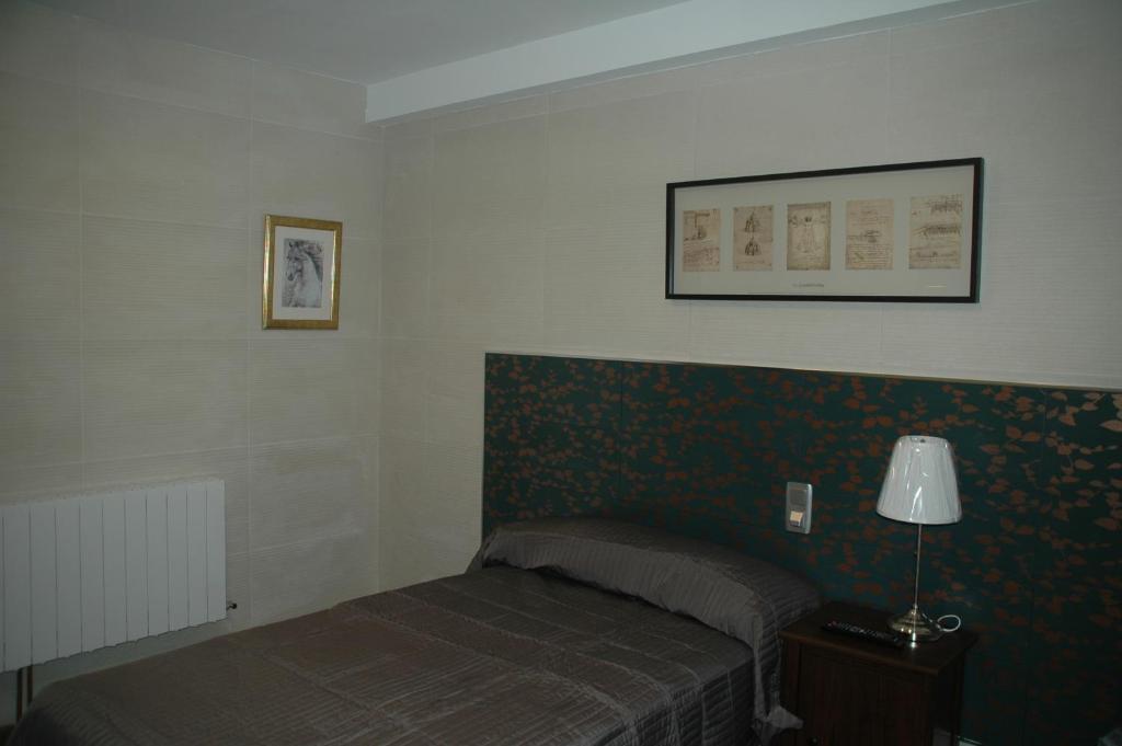 Posteľ alebo postele v izbe v ubytovaní Hostal Vintage Santander