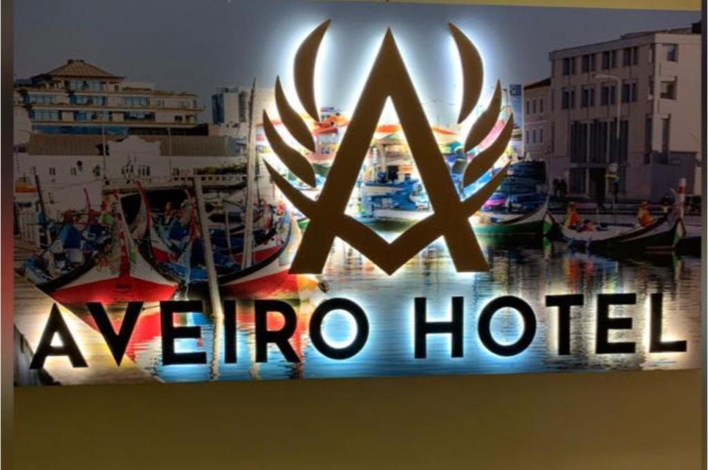 a sign for a reindeer hotel with boats in a harbor at Aveiro Hotel in Cúcuta