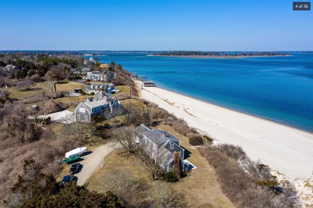 an aerial view of a house and the beach at 229 Scatteree Road North Chatham Cape Cod - - Nauset Watch in South Chatham