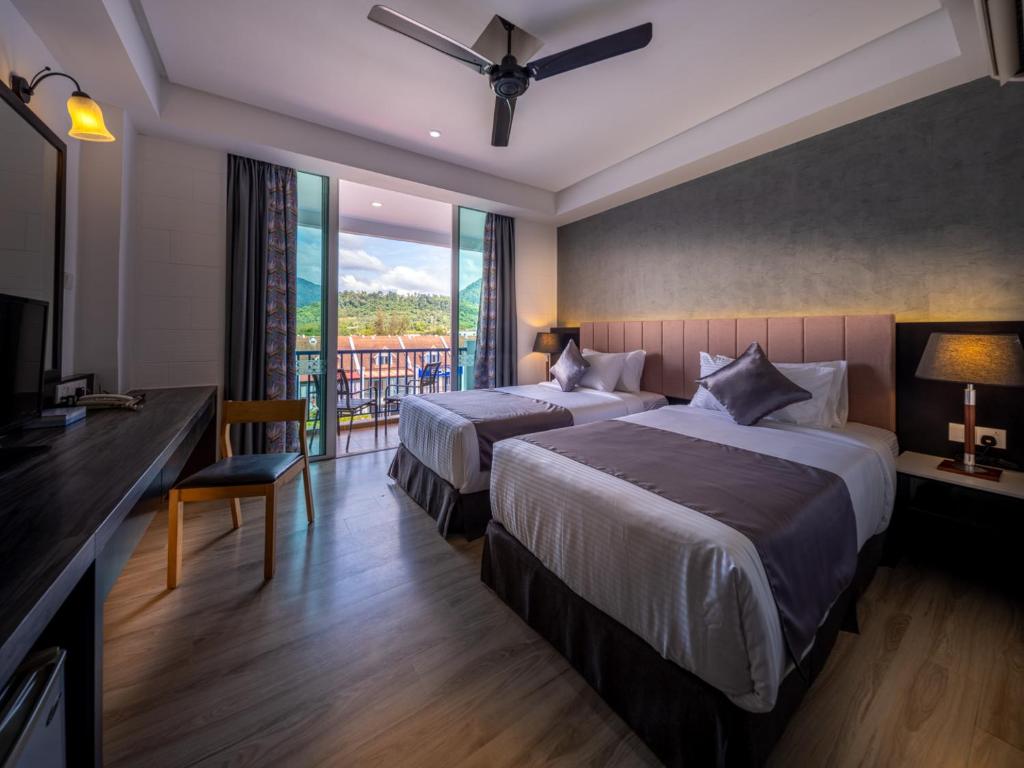 Postel nebo postele na pokoji v ubytování Dayang Bay Resort Langkawi