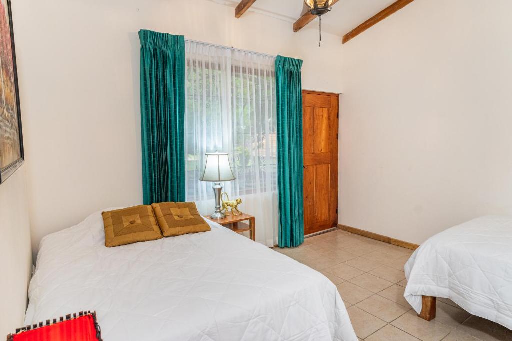 Postel nebo postele na pokoji v ubytování Hacienda La Norma Boho Boutique Hotel