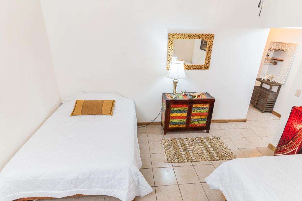 Postel nebo postele na pokoji v ubytování Hacienda La Norma Boho Boutique Hotel