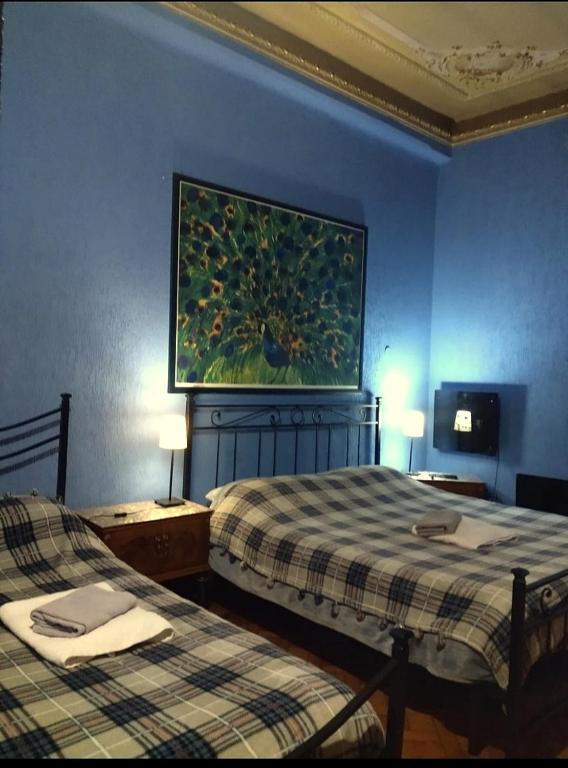 Postel nebo postele na pokoji v ubytování B&B Amarantha Gothica Genoa